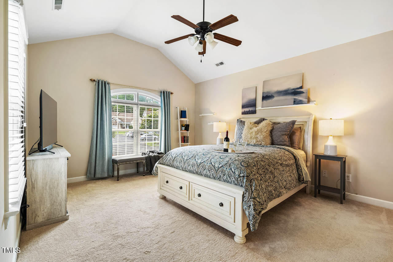 5515 South Roxboro Street, Unit 4 Durham, NC 27713 - Photo 14 of 34 a bed room with a bed and a television