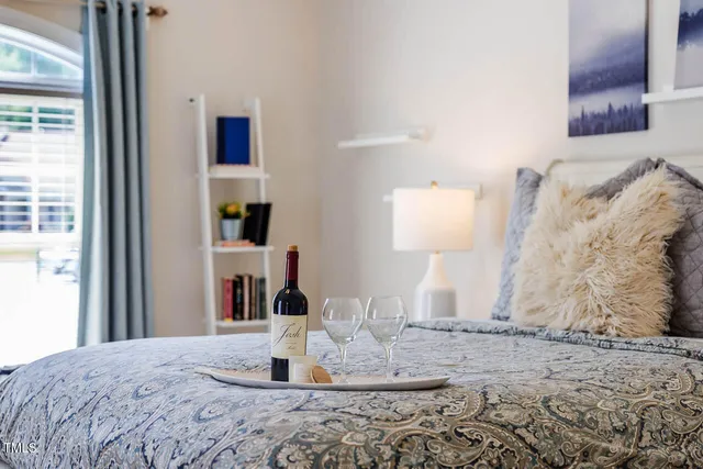 a bedroom with a bed and a dresser