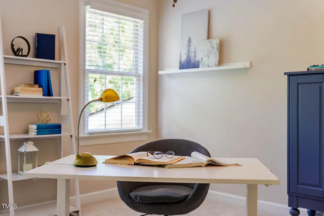 a view of a workspace with furniture