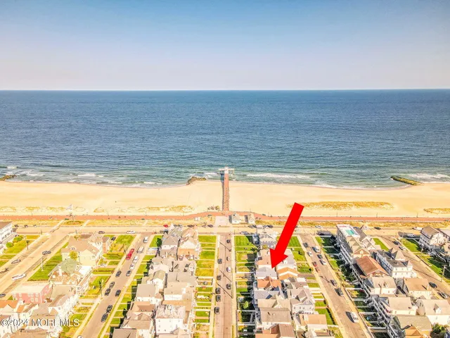 a view of an empty room and wooden floor