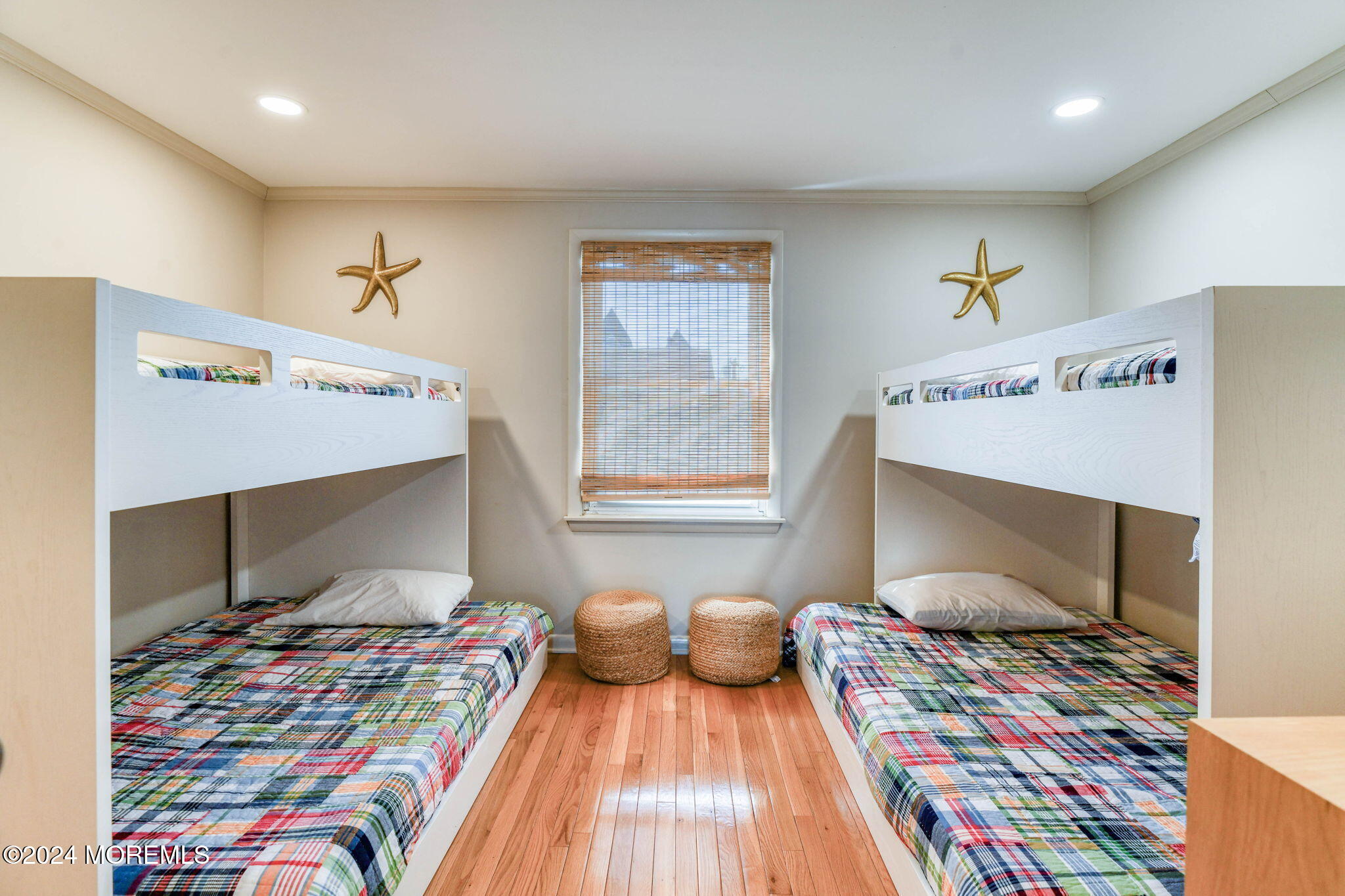 6 1/2 Embury Avenue Ocean Grove, NJ 07756 - Photo 21 of 24 a bedroom with a bed and wooden floor
