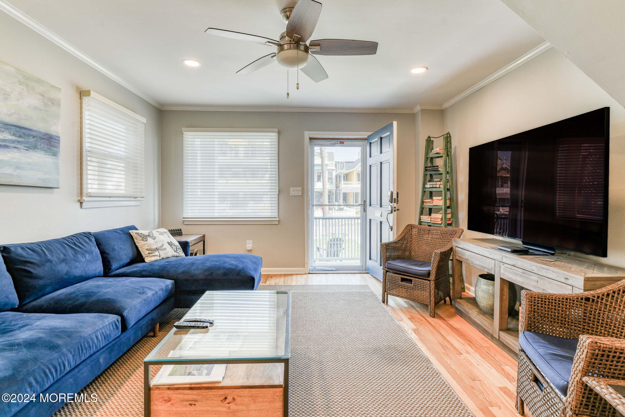 6 1/2 Embury Avenue Ocean Grove, NJ 07756 - Photo 8 of 24 a living room with furniture and a flat screen tv
