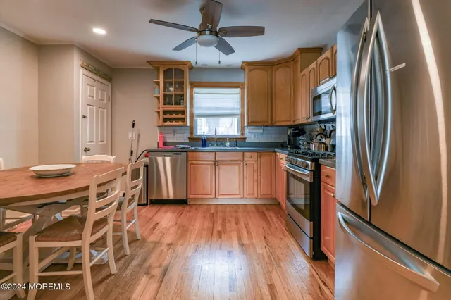 a view of a dining room with furniture and wooden floor