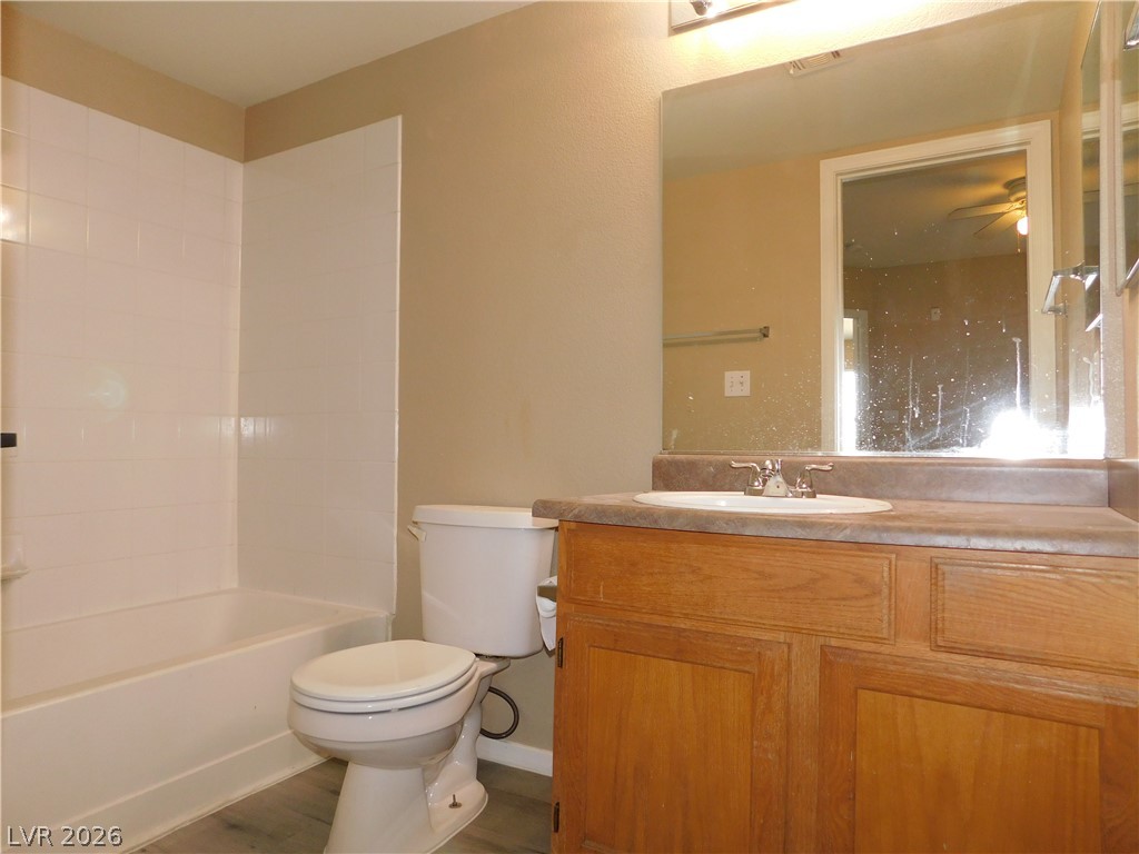 7255 West Sunset Road, Unit 2029 Las Vegas, NV 89113 - Photo 14 of 21 This bathroom features a functional vanity with ample counter space and a classic tub-shower combination.