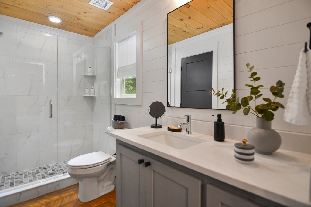 148 Haley Drive Cherry Log, GA 30522 - Photo 11 of 35 a bathroom with a sink a toilet and shower