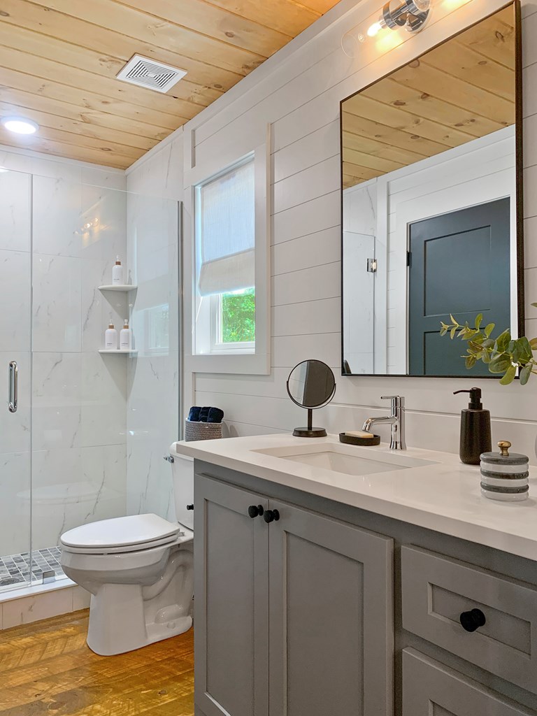 148 Haley Drive Cherry Log, GA 30522 - Photo 15 of 35 a bathroom with a toilet sink and mirror