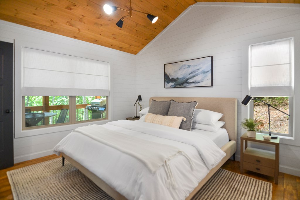 148 Haley Drive Cherry Log, GA 30522 - Photo 2 of 35 a bed room with a bed and a window