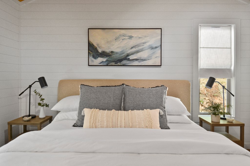 148 Haley Drive Cherry Log, GA 30522 - Photo 3 of 35 a bedroom with a large bed and a painting on the wall