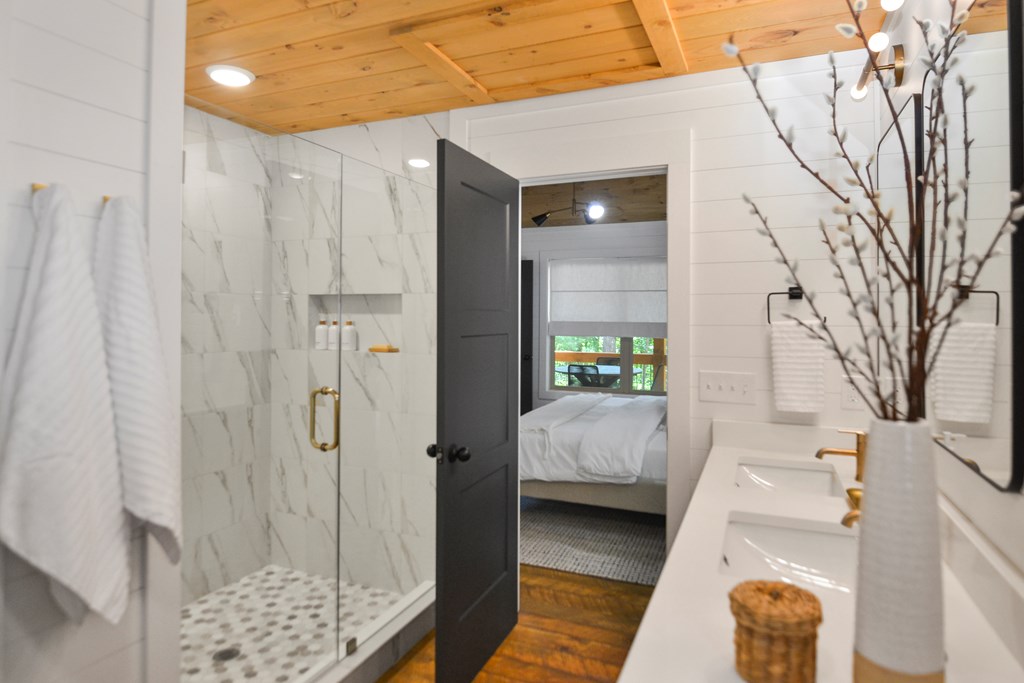 148 Haley Drive Cherry Log, GA 30522 - Photo 6 of 35 a bedroom with a bed and a view of bathroom