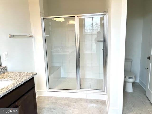 43264 Farringdon Square Ashburn, VA 20148 - Photo 16 of 27 a bathroom with a granite countertop sink and toilet