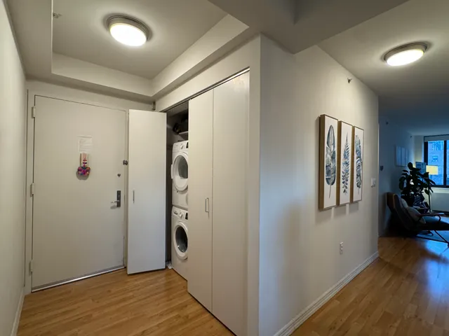 a view of livingroom with hardwood floor and hallway