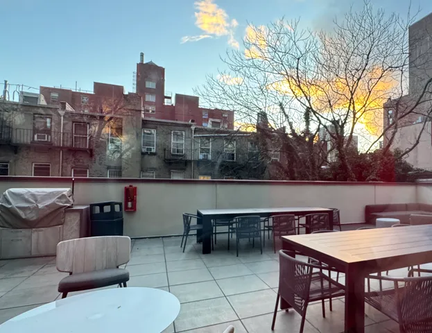 a terrace of a house with outdoor seating