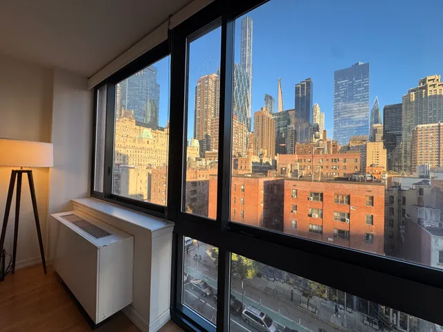 a view of a living room with a large window