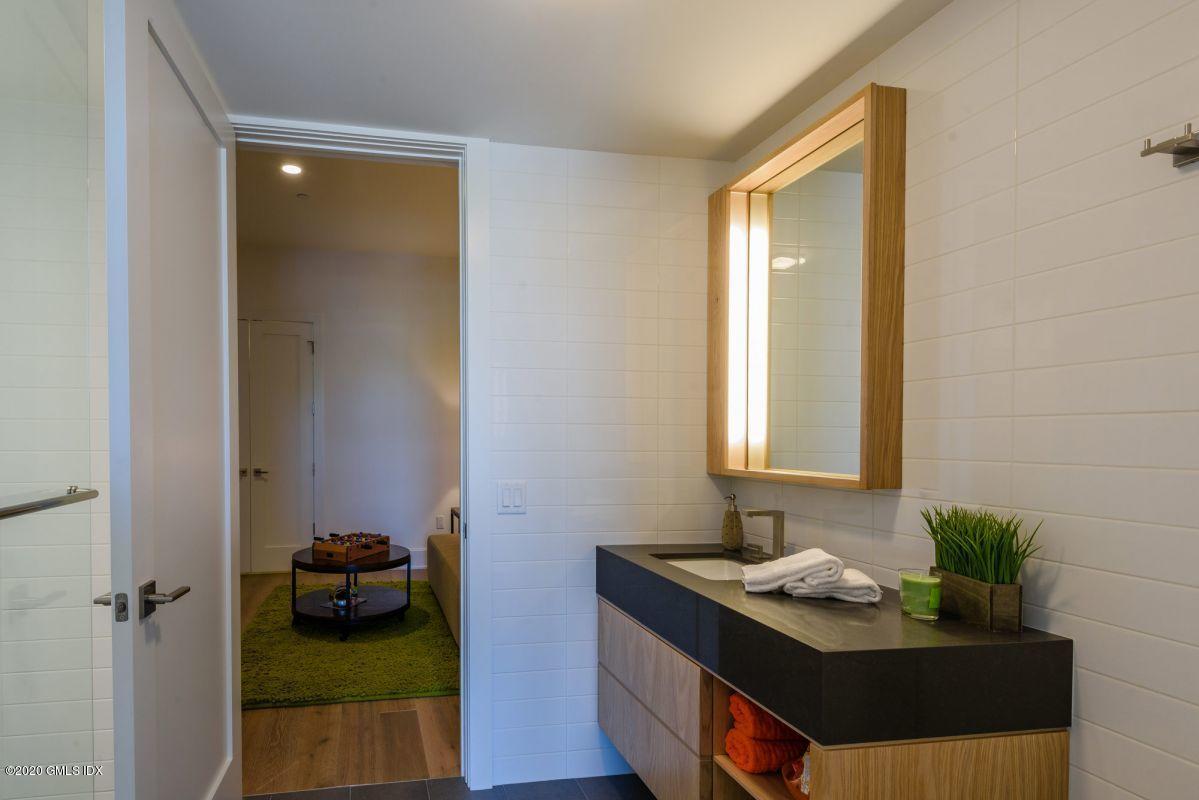 16 Old Track Road, Unit PH #3 Greenwich, CT 06830 - Photo 14 of 21 a bathroom with a sink and a mirror
