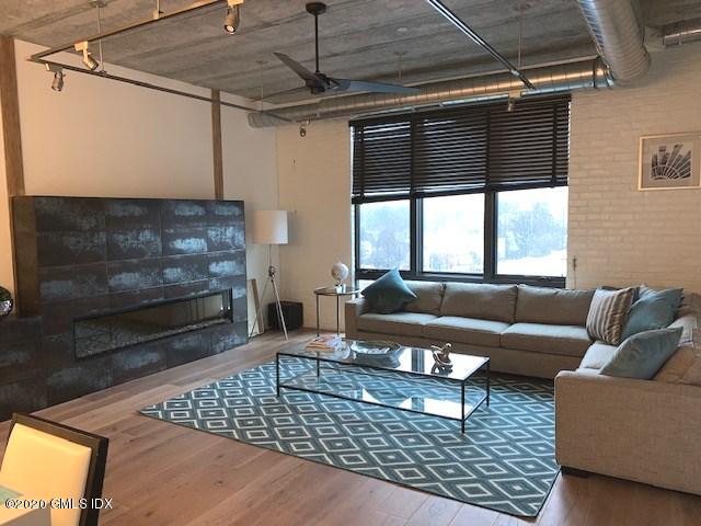 16 Old Track Road, Unit PH #3 Greenwich, CT 06830 - Photo 9 of 21 a living room with furniture and a fireplace