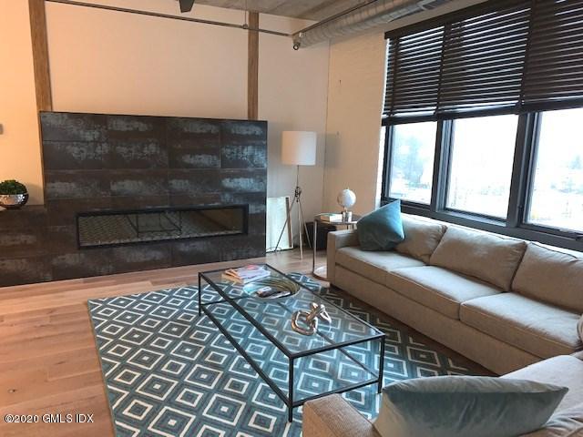 16 Old Track Road, Unit PH #3 Greenwich, CT 06830 - Photo 10 of 21 a living room with furniture and a fireplace