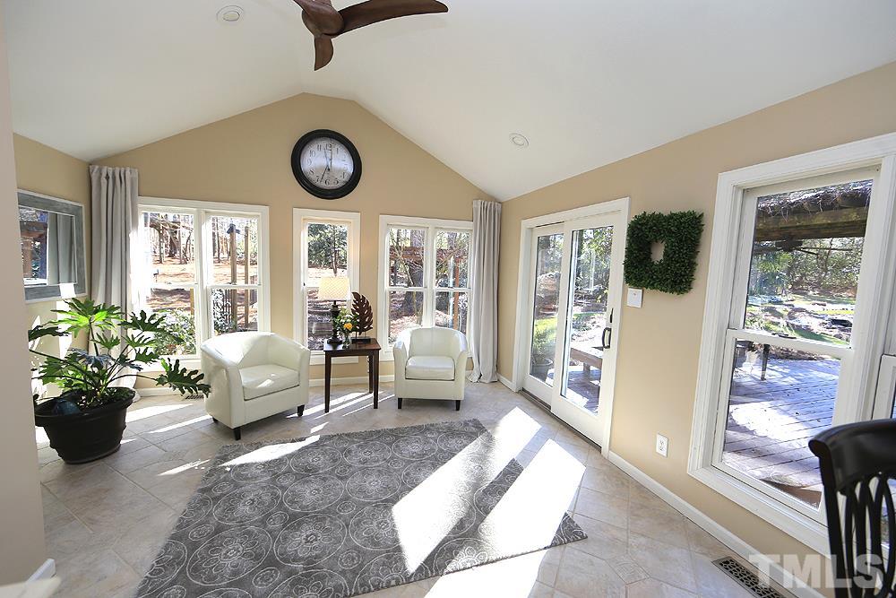 2601 Salisbury Plain Raleigh, NC 27613 - Photo 16 of 30 a living room with furniture chandelier and a large window