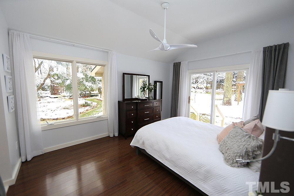 2601 Salisbury Plain Raleigh, NC 27613 - Photo 20 of 30 a bedroom with a large bed and a window
