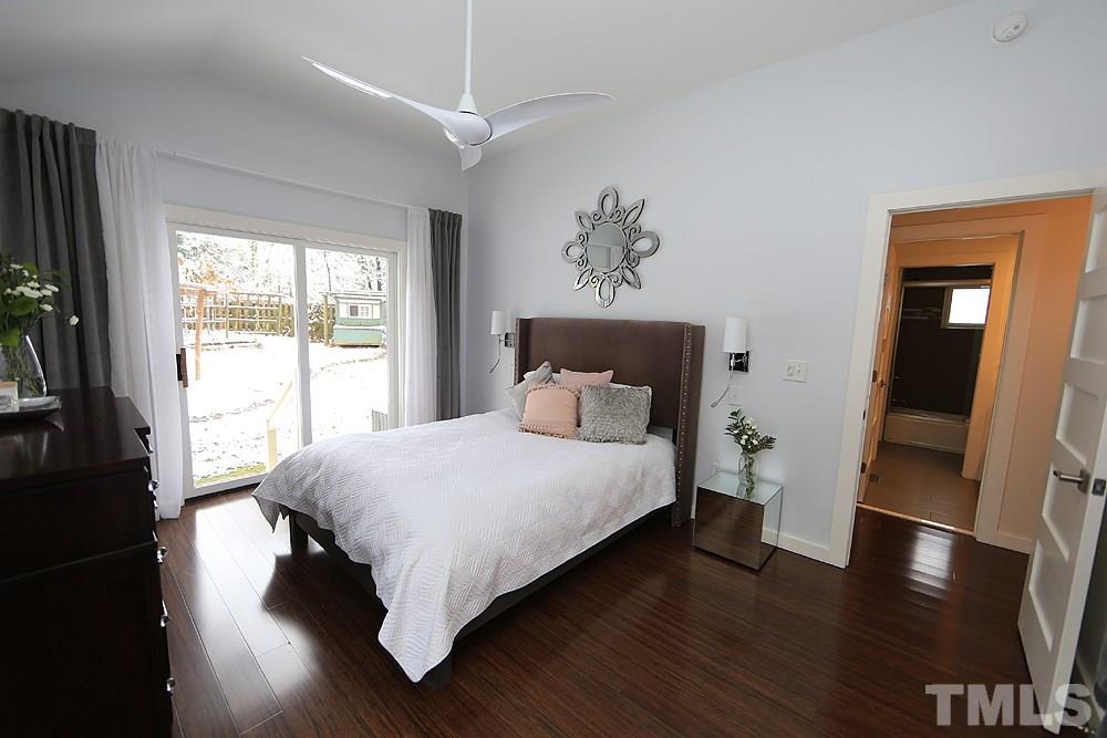 2601 Salisbury Plain Raleigh, NC 27613 - Photo 21 of 30 a bed sitting in a bedroom next to a window