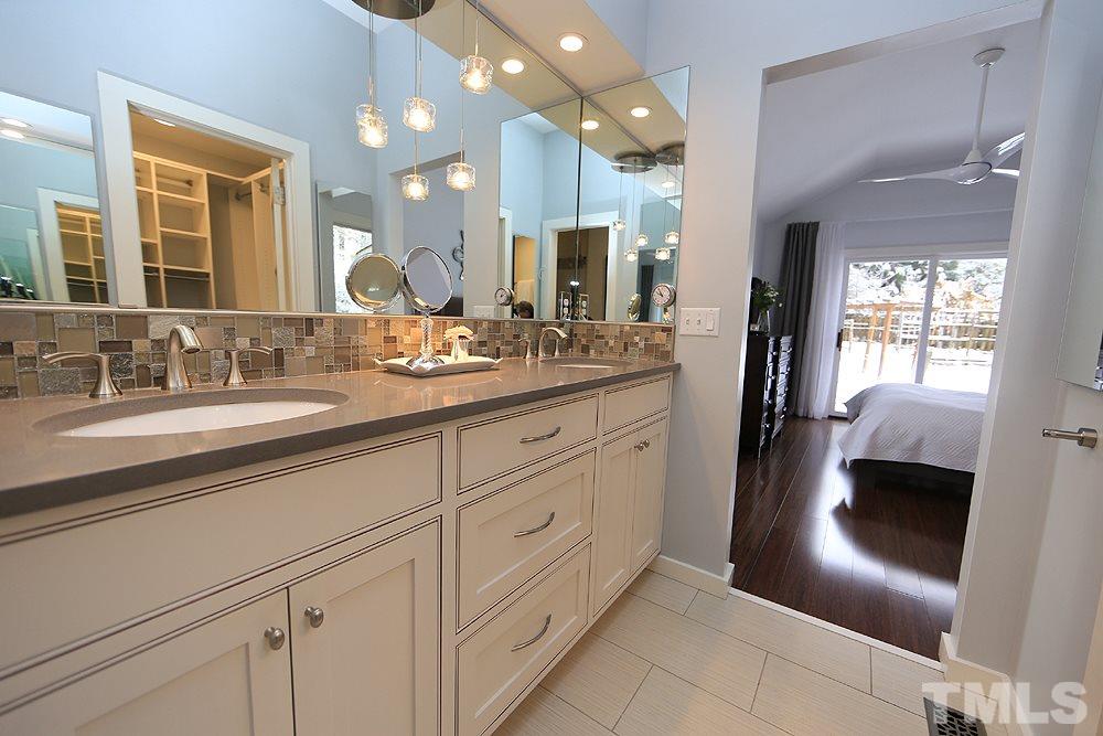 2601 Salisbury Plain Raleigh, NC 27613 - Photo 22 of 30 a spacious bathroom with a double vanity sink and a mirror