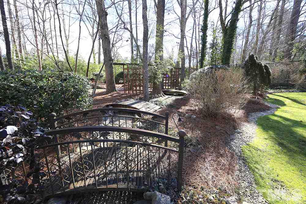 2601 Salisbury Plain Raleigh, NC 27613 - Photo 29 of 30 a view of a yard with plants and trees