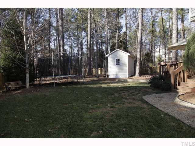 2501 Sugar Maple Court Raleigh, NC 27615 - Photo 12 of 12 a front view of a house with garden