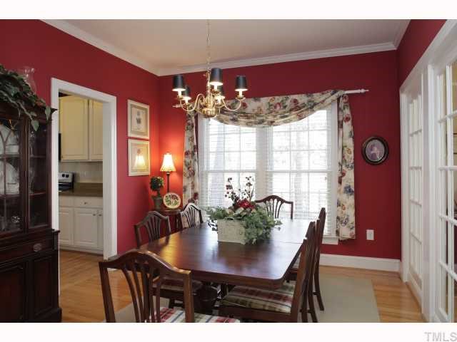 2501 Sugar Maple Court Raleigh, NC 27615 - Photo 3 of 12 a view of a dining room with furniture and chandelier