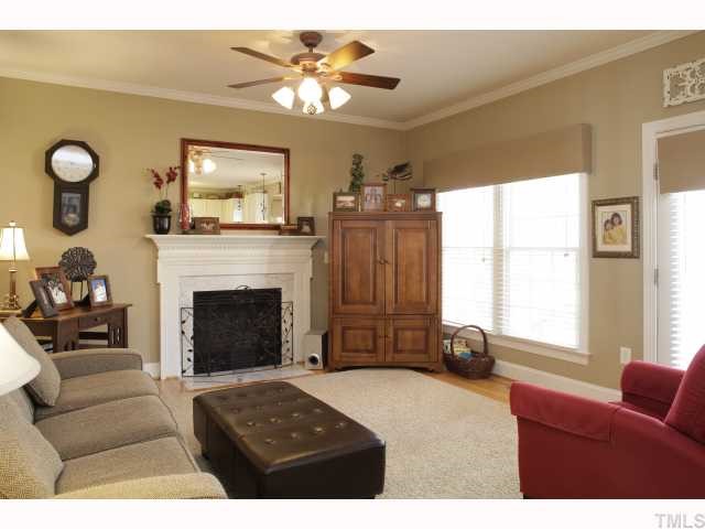 2501 Sugar Maple Court Raleigh, NC 27615 - Photo 4 of 12 a living room with furniture and a fireplace