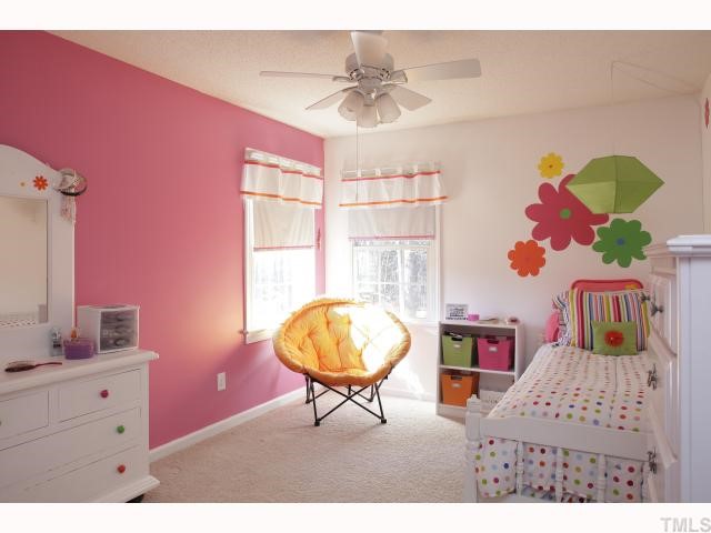 2501 Sugar Maple Court Raleigh, NC 27615 - Photo 7 of 12 a bedroom with furniture and a mirror