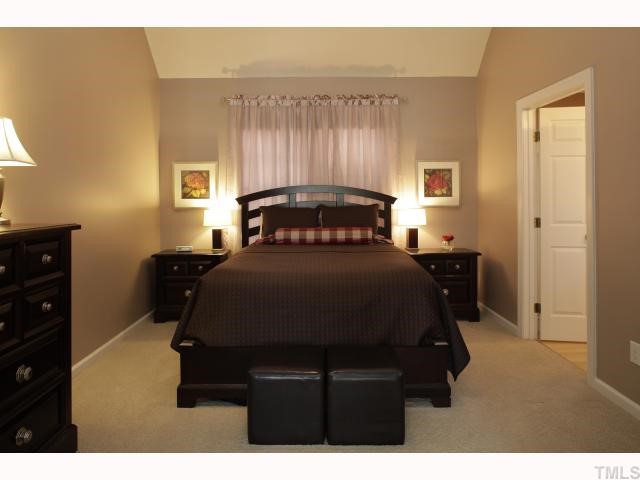 2501 Sugar Maple Court Raleigh, NC 27615 - Photo 8 of 12 a bedroom with a bed window and a table