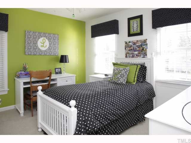 2501 Sugar Maple Court Raleigh, NC 27615 - Photo 10 of 12 a bedroom with a bed and a table in it