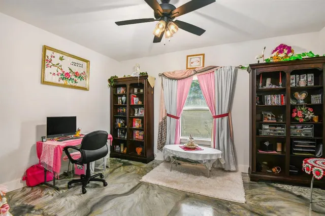 a view of a workspace with furniture and toys
