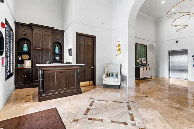 a living room with furniture and a gate