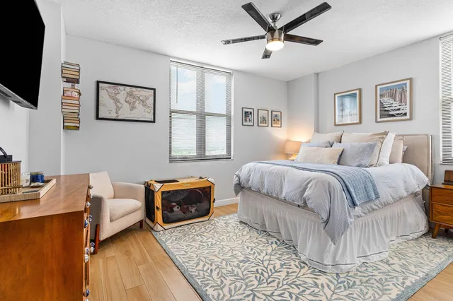 a bedroom with a bed and flat screen tv