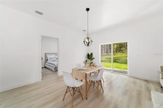 a view of a room with furniture window and wooden floor