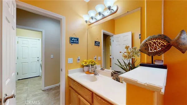 a bathroom with a sink a mirror and a shower