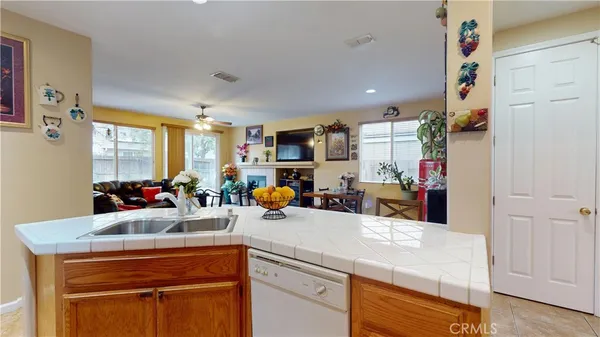 a kitchen view of living room and utility room
