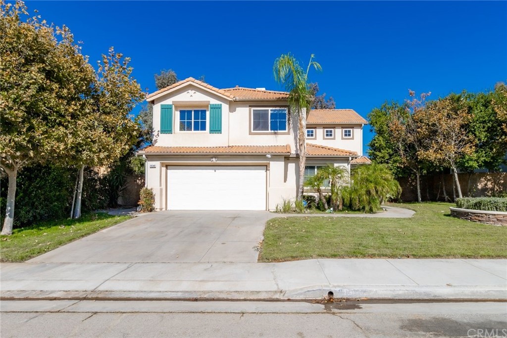 28346 Saddlecrest Street Menifee, CA 92585 - Photo 1 of 35 a front view of a house with a yard and garage
