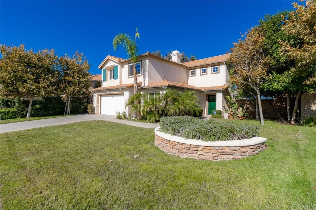 28346 Saddlecrest Street Menifee, CA 92585 - Photo 2 of 35 a front view of a house with a yard