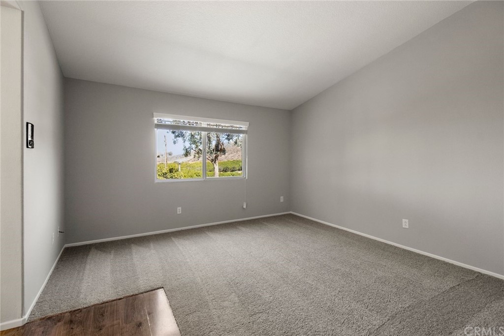 28346 Saddlecrest Street Menifee, CA 92585 - Photo 15 of 35 an empty room with windows