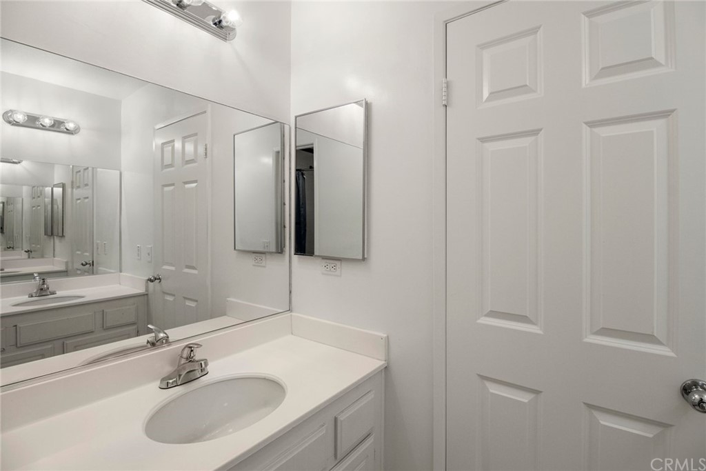 28346 Saddlecrest Street Menifee, CA 92585 - Photo 20 of 35 a bathroom with a sink and a mirror