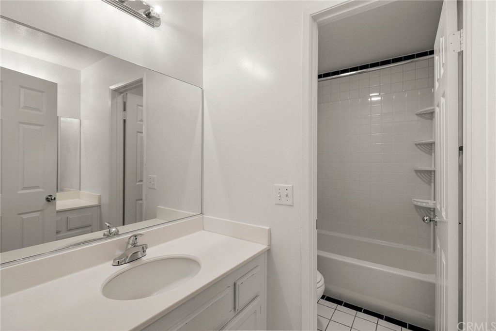 28346 Saddlecrest Street Menifee, CA 92585 - Photo 22 of 35 a bathroom with a sink toilet and shower