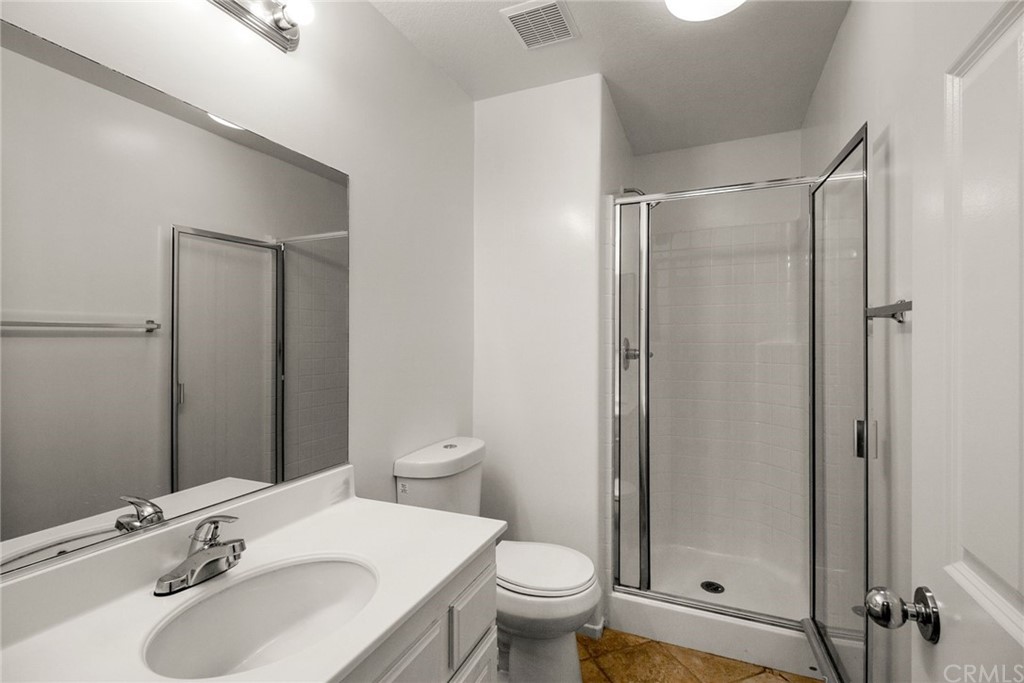 28346 Saddlecrest Street Menifee, CA 92585 - Photo 24 of 35 a bathroom with a sink toilet and shower