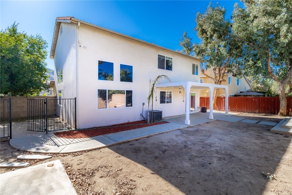 28346 Saddlecrest Street Menifee, CA 92585 - Photo 29 of 35 a view of a house with a backyard