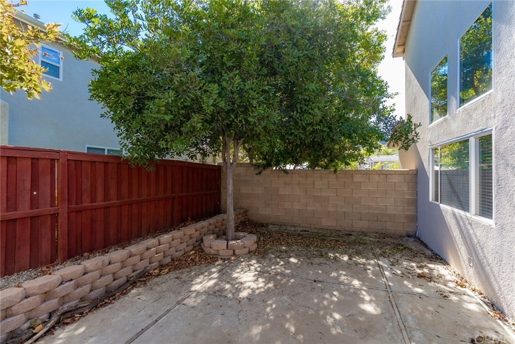 28346 Saddlecrest Street Menifee, CA 92585 - Photo 30 of 35 a view of a backyard with wooden fence