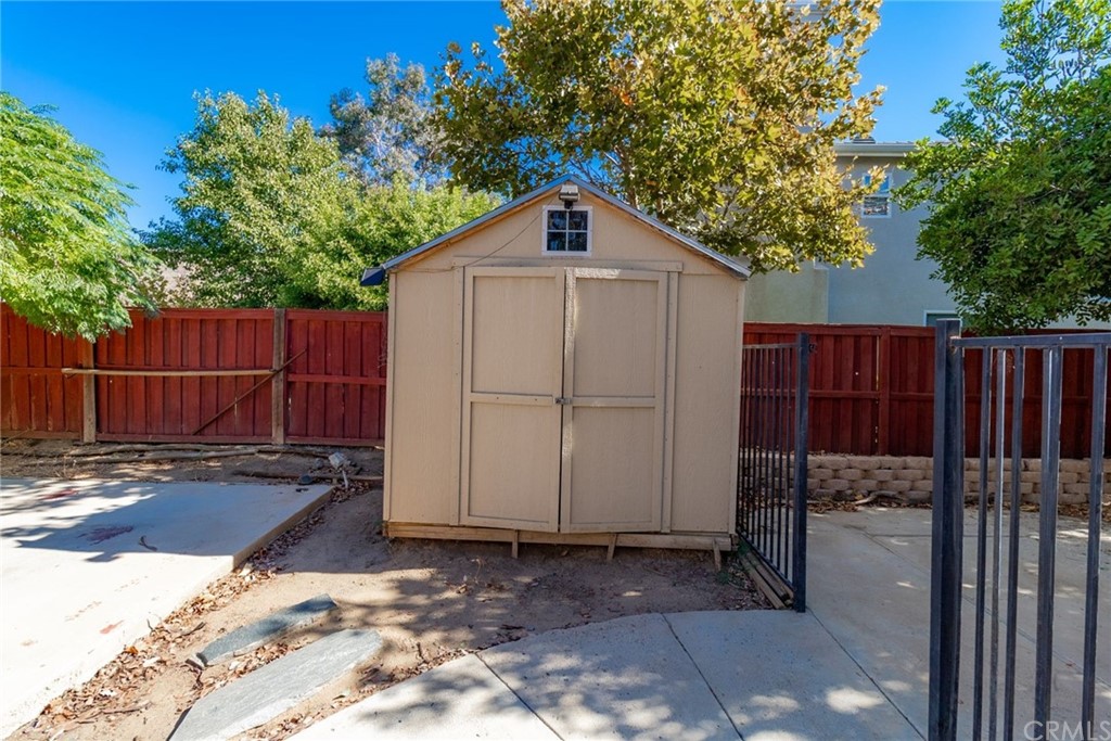 28346 Saddlecrest Street Menifee, CA 92585 - Photo 35 of 35 a view of a backyard with wooden fence
