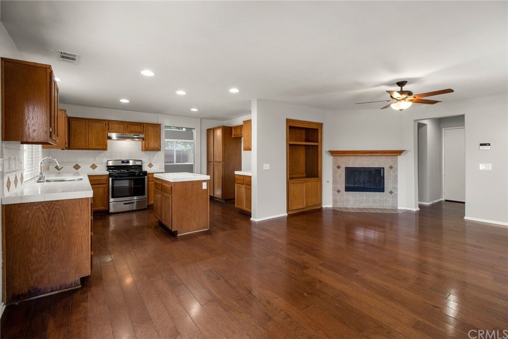 28346 Saddlecrest Street Menifee, CA 92585 - Photo 10 of 35 a view of kitchen with cabinets and wooden floor
