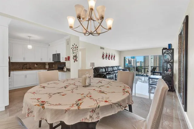 a large kitchen with a table and chairs