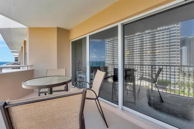 a balcony with chairs