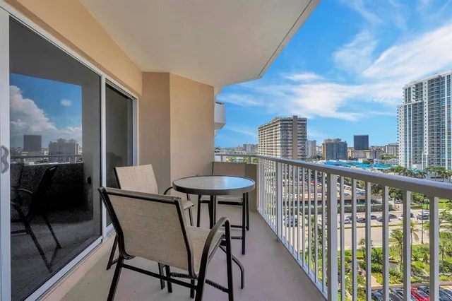 a view of a balcony with furniture